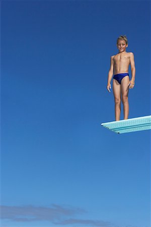 posing diving board swim suit pool - Boy on Diving Board Stock Photo - Premium Royalty-Free, Code: 600-00814649