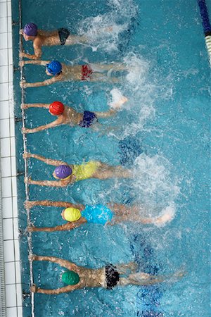 swimming kid in swimming cap photos - Swimmers in Pool Stock Photo - Premium Royalty-Free, Code: 600-00814681