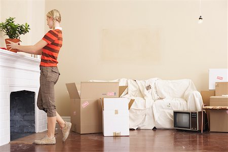 Woman Unpacking Stock Photo - Premium Royalty-Free, Code: 600-00824275