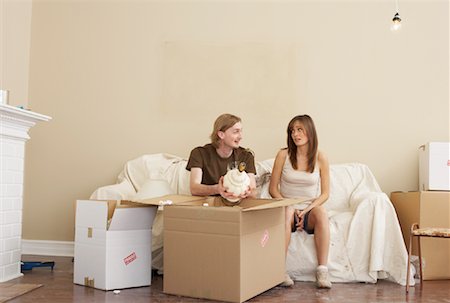 Couple Unpacking Boxes Stock Photo - Premium Royalty-Free, Code: 600-00824398