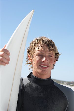 Surfer At The Beach Stock Photo - Premium Royalty-Free, Code: 600-00824620