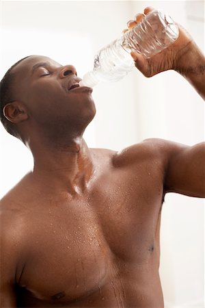 exercise black people water - Portrait of Man Drinking Water Stock Photo - Premium Royalty-Free, Code: 600-00824696