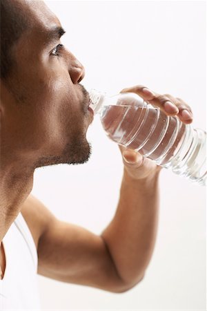 simsearch:600-00823179,k - Man Drinking Water Fotografie stock - Premium Royalty-Free, Codice: 600-00823150