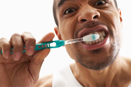 simsearch:600-00823179,k - Man Brushing Teeth Fotografie stock - Premium Royalty-Free, Codice: 600-00823162