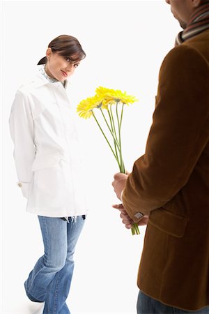 Man Giving Woman Flowers Stock Photo - Premium Royalty-Free, Code: 600-00823184