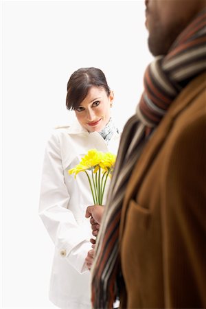 Man Giving Woman Flowers Stock Photo - Premium Royalty-Free, Code: 600-00823186