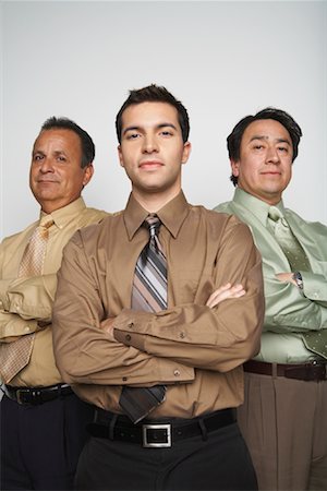 portrait of happy mature businessman standing arms crossed in office - Portrait of Businessmen Stock Photo - Premium Royalty-Free, Code: 600-00823457