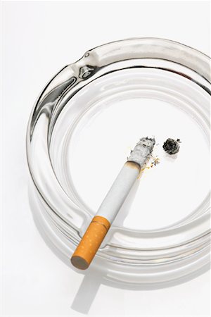 simsearch:700-02757138,k - Cigarette in Ashtray Stock Photo - Premium Royalty-Free, Code: 600-00823635