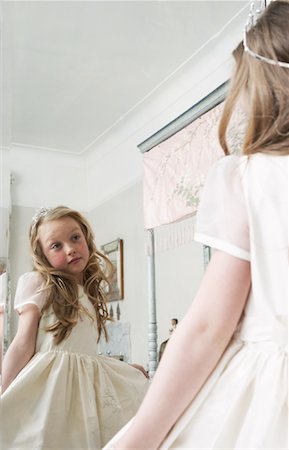 Girl Wearing Dress, Looking In Mirror Stock Photo - Premium Royalty-Free, Code: 600-00823726