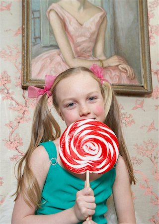 ribbon and pigtails - Girl with Lollipop Stock Photo - Premium Royalty-Free, Code: 600-00823787