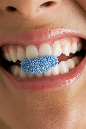eat mouth closeup - Woman Eating Candy Stock Photo - Premium Royalty-Free, Code: 600-00823951