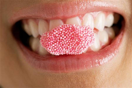 eat mouth closeup - Woman Eating Candy Stock Photo - Premium Royalty-Free, Code: 600-00823952