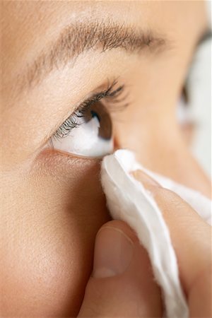 Woman Wiping Eye Stock Photo - Premium Royalty-Free, Code: 600-00823961