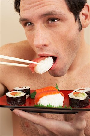 simsearch:600-00845951,k - Man Eating Sushi Foto de stock - Sin royalties Premium, Código: 600-00845968