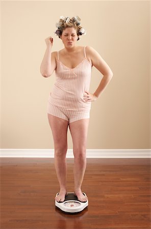 Woman Weighing Self Stock Photo - Premium Royalty-Free, Code: 600-00846017