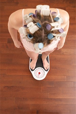 Woman Weighing Self Stock Photo - Premium Royalty-Free, Code: 600-00846010