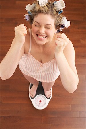 Woman Weighing Self Stock Photo - Premium Royalty-Free, Code: 600-00846013