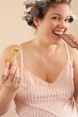 Woman with Granola Bar and Chocolate Bar Stock Photo - Premium Royalty-Free, Code: 600-00846047