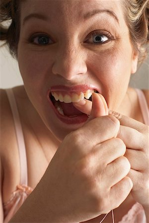 simsearch:600-00846027,k - Woman Flossing Teeth Stock Photo - Premium Royalty-Free, Code: 600-00846064