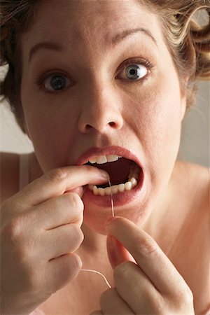simsearch:600-00846027,k - Woman Flossing Teeth Stock Photo - Premium Royalty-Free, Code: 600-00846065