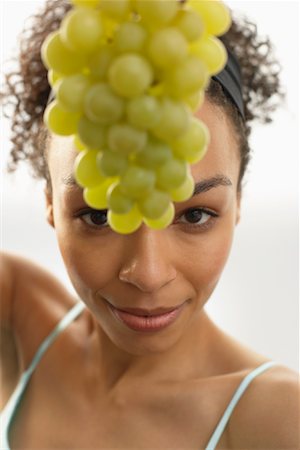 Woman Holding Bunch of Grapes Stock Photo - Premium Royalty-Free, Code: 600-00846417