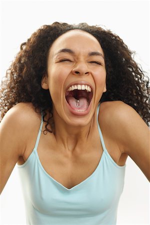 Portrait of Woman with Pierced Tongue Laughing Stock Photo - Premium Royalty-Free, Code: 600-00846419