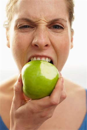 eat mouth closeup - Woman Eating Apple Stock Photo - Premium Royalty-Free, Code: 600-00846410