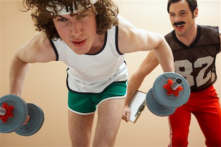 simsearch:700-00526639,k - Man Lifting Weights With Personal Trainer Stock Photo - Premium Royalty-Free, Code: 600-00846566