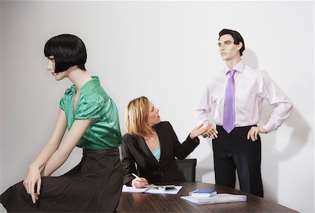Businesswoman and Mannequins in Office Stock Photo - Premium Royalty-Free, Code: 600-00846670
