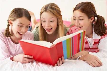 simsearch:600-00866282,k - Girls Looking at Book Together Stock Photo - Premium Royalty-Free, Code: 600-00847952