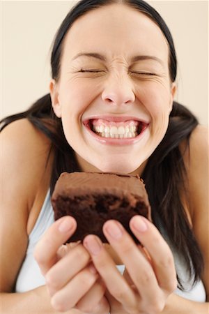 simsearch:600-06383843,k - Woman Holding Piece of Cake Stock Photo - Premium Royalty-Free, Code: 600-00848084