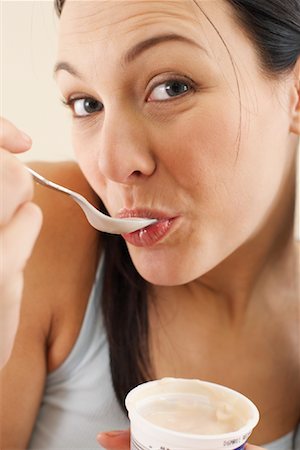 simsearch:600-00848083,k - Woman Eating Yogurt Stock Photo - Premium Royalty-Free, Code: 600-00848082
