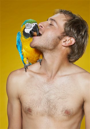 Portrait of Man with Parrot Foto de stock - Sin royalties Premium, Código: 600-00848343