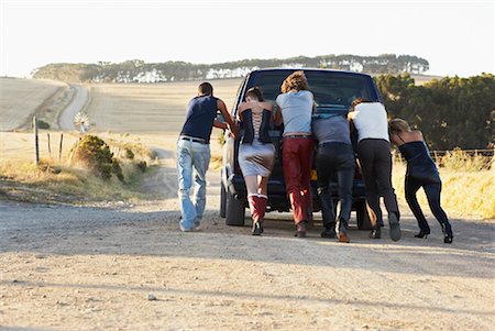 pushing broken down car - People Pushing Stalled Van Stock Photo - Premium Royalty-Free, Code: 600-00848516