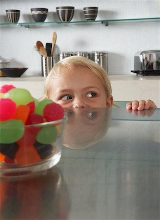 sneaking boy - Child Sneaking Candy Stock Photo - Premium Royalty-Free, Code: 600-00848628