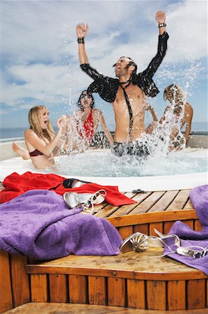 simsearch:600-00848663,k - Man in Hot Tub with Three Women Stock Photo - Premium Royalty-Free, Code: 600-00848676