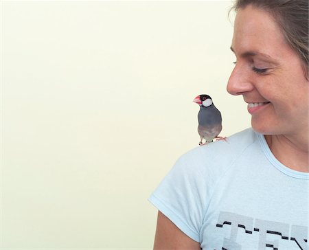 simsearch:600-00864449,k - Woman with Bird on Shoulder Stock Photo - Premium Royalty-Free, Code: 600-00864403