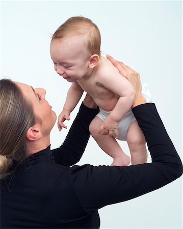 simsearch:600-01260132,k - Woman Holding Baby Stock Photo - Premium Royalty-Free, Code: 600-00864442
