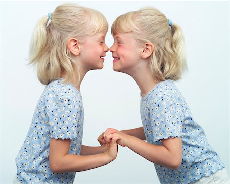 ponytail white background not full body - Twins Giggling Together Stock Photo - Premium Royalty-Free, Code: 600-00864464