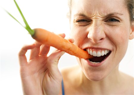 simsearch:600-00865934,k - Woman Biting Carrot Stock Photo - Premium Royalty-Free, Code: 600-00865933