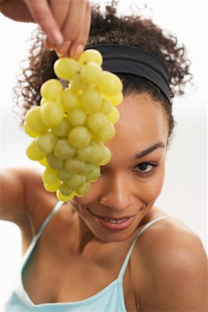Woman Holding Grapes Stock Photo - Premium Royalty-Free, Code: 600-00865970
