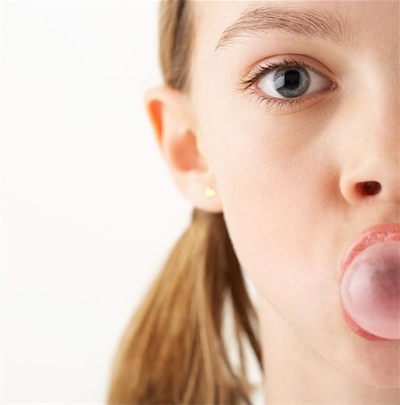 Girl Blowing Bubble with Gum Stock Photo - Premium Royalty-Free, Code: 600-00866050
