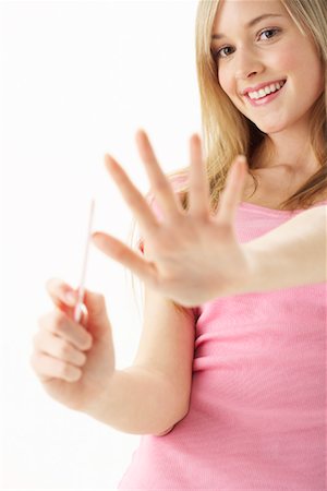 Girl Filing Nails Stock Photo - Premium Royalty-Free, Code: 600-00866225