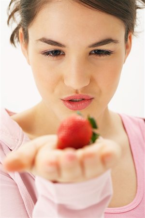 simsearch:600-00866193,k - Girl Holding Strawberry Stock Photo - Premium Royalty-Free, Code: 600-00866257