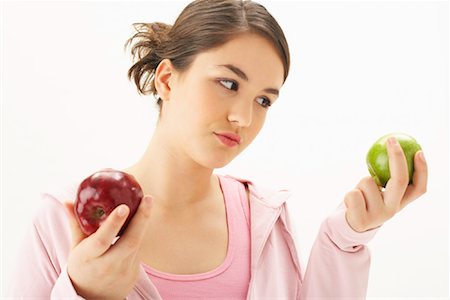 Girl Holding Apples Stock Photo - Premium Royalty-Free, Code: 600-00866253