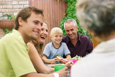 father son grandson back - Grandfather and Grandson Outdoors with Family Stock Photo - Premium Royalty-Free, Code: 600-00866610