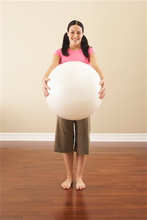 Portrait of Woman With Exercise Ball Stock Photo - Premium Royalty-Free, Code: 600-00866813