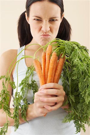 simsearch:600-00848083,k - Woman Holding Carrots Stock Photo - Premium Royalty-Free, Code: 600-00866847