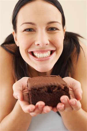 simsearch:600-00865934,k - Woman Holding Brownie Stock Photo - Premium Royalty-Free, Code: 600-00866850