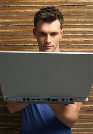 simsearch:600-01295872,k - Man Using Laptop Stock Photo - Premium Royalty-Free, Code: 600-00909503